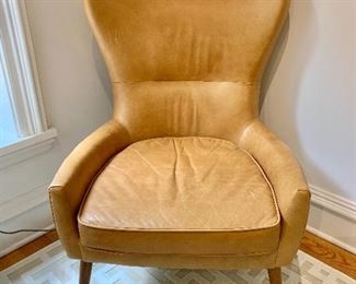 $800 - Pair of West Elm 'Erik" leather wing back chairs - 39"H x 27"W x 31"D. Height to seat is approximately 18".  AS IS - Condition consistent with use and wear.
