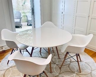 $350 - Contemporary table and chairs - Table 28.5"H x 47" diameter. Chairs 31"H x 24.5"W x 23"D  Height to seat approximately 18"