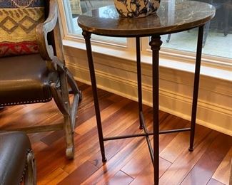Round metal table with marble top 17" diameter and 25 height. 