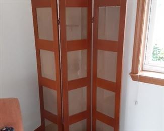 room divider holds photos