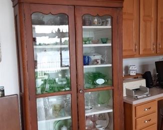 vintage hutch with vintage dishes.  A lot of depression glass.