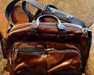Item 218:  Tumi Leather Bag: $95