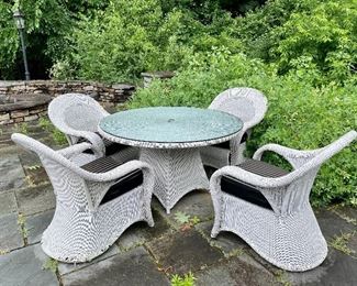 Item 233:  Wicker Table & (4) Armchairs with Cushions:  $850 for set                                                                                                             Table - 54" x 30.5"                                                                                         Armchairs - 30"l x 23"w x 37.5"h