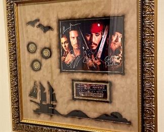 Item 211:  Autographed "Pirates of the Caribbean"  with some original coins used in the movie- 24.25" x 24.25":  $500