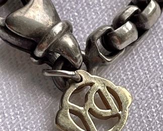 detail - chain is sterling silver with this 14K hang tag