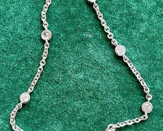 Item 463:  Rhodium plated 925 sterling silver HUMILIS bracelet with Tau cross and cubic zirconia: $35