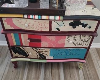 Very artsy little chest all painted up to brighten any room