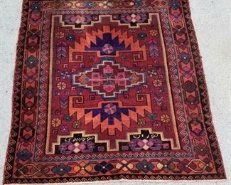 One of several signed Persian carpets in this sale.
