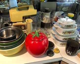 Kitchen packed with a wide array of vintage cookware, bakeware, utensils, etc.