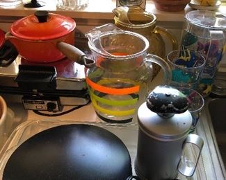 Kitchen packed with a wide array of vintage cookware, utensils, kitchen tools, etc.