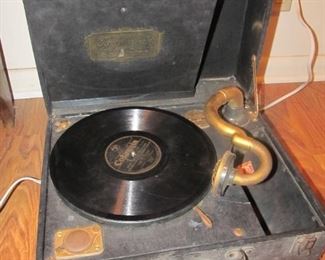 Antique Brunswick Panatrope portable record player. (missing the crank) Comes with all the records shown