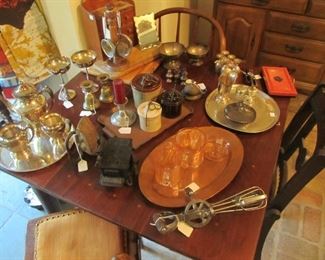 Depression glass, silver serving pieces, copper serving trays, pewter items.