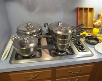 Decorative copperware, vintage tins, rolling pins, cast iron, & vintage pots & pans.