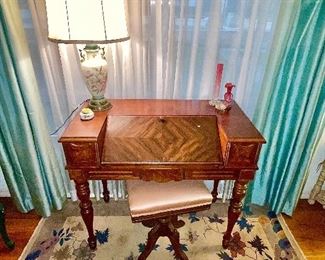 Antique Walnut Secretary drop-down desk, H.E. Shaw Furniture Company.
Antique Piano Bench swivel seat, Pink Silk upholstery. 