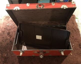Red metal trunk with plastic tray
