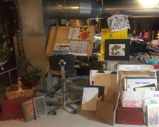 Three different sizes of art easels and lots of art supplies and craft supplies.