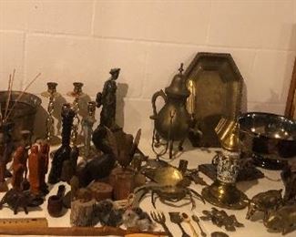 Several tables of home decor - ceramic, lots of brass, glass - a little bit of everything
