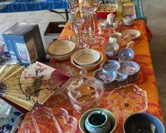 Assorted decorative serving pieces and glassware