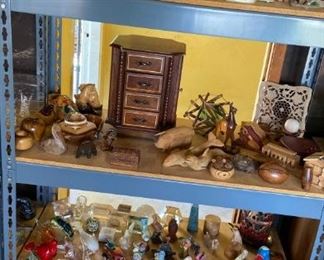 Curio cabinet treasures, figurines, and collectables.