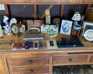 Curio cabinet treasures, figurines, and collectables.