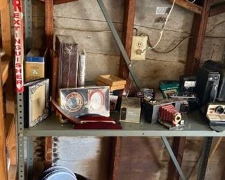 Gramaphone records, antique and modern cameras, assorted picture frames and photo albums