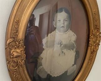 Antique hanging wall frame with curved glass.