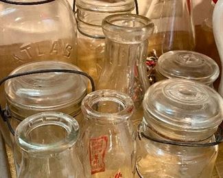 Lots of jars including ball jars and milk jars