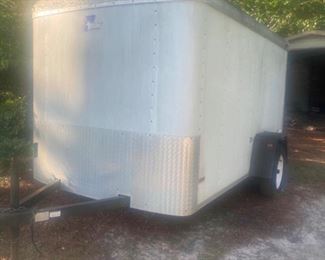 Pace America 6’x12’ Cargo Trailer. Back Doors swing open. It also has a side door that swings open. The inside of the trailer is in great shape, all the wood on the sides and floor are solid. Tires appear to be ok, they’re holding air. Included inside is some rope, a spare tire, a wooden box with hitch accessories and a helium tank. Trailer has been sitting for a couple years and has not been moved. https://ctbids.com/#!/description/share/974361