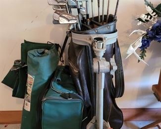 Set of golf clubs with irons and woods, Golf Bag with cart, 3 boxes of golf balls and some used ones as well. 2 folding chairs and a cooler bag. https://ctbids.com/#!/description/share/974356