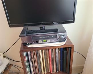 Small Toshiba 24 inch TV, Hitachi VHS player, Record Stand 31” X 18 X 14.5”. Deep Collection of various artist LP records & 45s. Includes Bay City Rollers, ABBA, Holiday music and more, all in great condition. https://ctbids.com/#!/description/share/974360