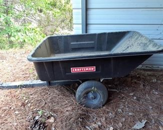 Craftsman cart attaches to a lawn mower or tractor. Measures from back of cart to front of tongue 71" and is 32" wide and 25" tall.