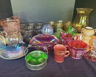 Carnival, depression and colored glass. All uniquely beautiful. Liven up your home with this set of pretty pieces. Over 20 cups, a pichter and carnival glass decor. https://ctbids.com/#!/description/share/974509