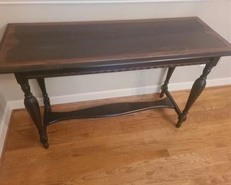 
Very pretty entryway table has inlaid wood design giving it two different shades of wood. Table is in excellent condition and stained to a darker color. Measures 48" x 18" x 30". https://ctbids.com/#!/description/share/974623