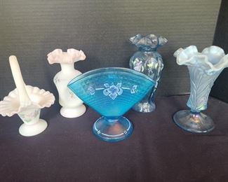 Three blue pieces one shiny like carnival glass and two white and pink pieces. Fenton glass is always so beautiful and the luxury of glass. All floral on glass is handpainted. The blue fan like piece is for the 90th anniversary has a texture in painted flowers like drops of water. https://ctbids.com/#!/description/share/974507