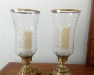 Large and heavy brass and glass candle holders can hold taper or pillar candles. 18.5" tall and 7" across.  https://ctbids.com/#!/description/share/981184