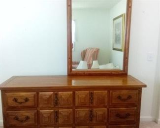 Wooden 12 drawer dresser with matching mirror measures 32" x 66" x 20". Mirror is 46.5" x 35" x 2". https://ctbids.com/#!/description/share/981183