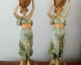 Ceramic ladies holding baskets. 20.5" x 6" x 7". Marked "NEW ART WARES" and numbered 243. https://ctbids.com/#!/description/share/981187
