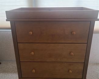 Baby changing table with buckle for security. Table has three spacious drawers for storage. Measures 33" x 19" x 38". https://ctbids.com/#!/description/share/981226