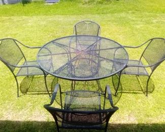 Metal table and 4 chairs. Table is 48" round and is 28" tall. Chairs are 32" x 22" and seat is 16". Good condition with minor surface rust. https://ctbids.com/#!/description/share/981244