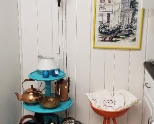 another view of kitchen with cuckoo clock, art, 3 tiered table