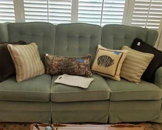 Sage green three cushion sofa, lots of pillows