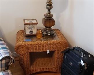 wicker side table, mid century lamp, luggage