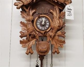 hand carved cuckoo clock with deer top piece