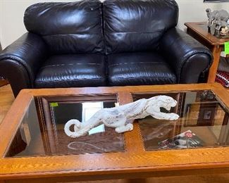 Leather couch and love seat 
Mission style coffee and end tables