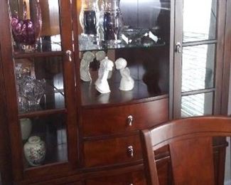 This china cabinet is stunning!  It not only has glass doors for viewing and shelving, but also numerous drawers and side cabinets.