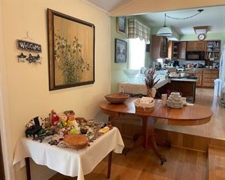 KITCHEN VIEW; ONE OF TWO OAK PEDESTAL TABLES AND TURTLE AND PIG TABLE