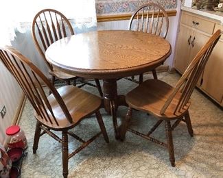 Round wood table with Formica top - includes 1 leaf and 4 chairs (leaf not shown)