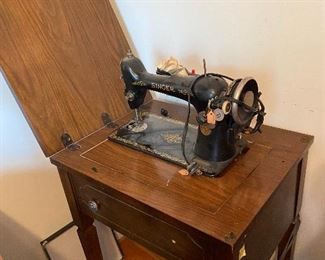 Singer sewing machine in case.