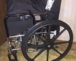 Like new wheelchair with foot rests (not shown).