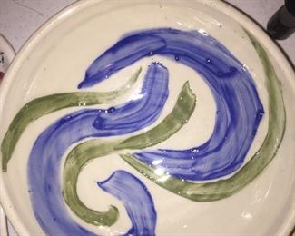 A vibrant free-form design on a ceramic bowl. 